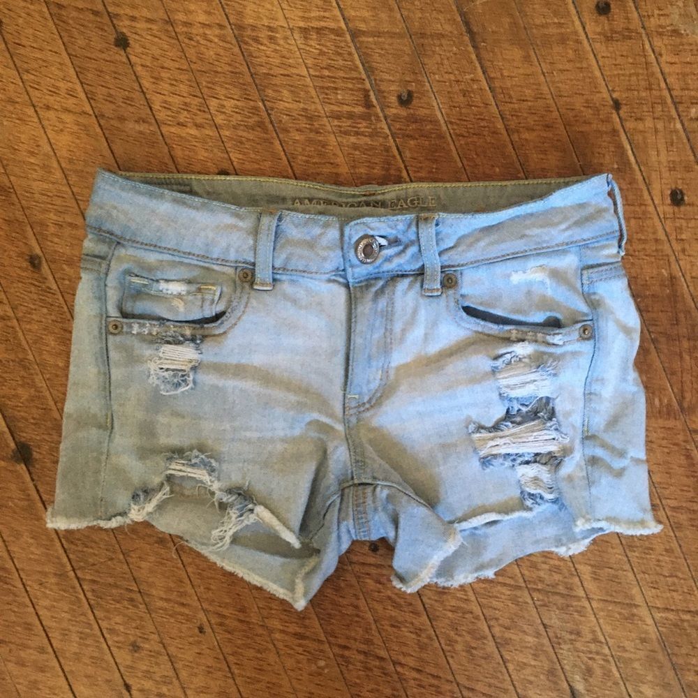 American Eagle midi 4 distressed light wash cutoff shorts